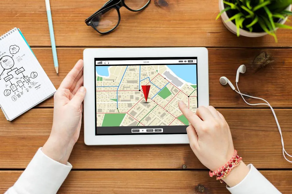 Business technology people navigation concept close up woman with gps navigator map tablet pc computer screen wooden table
